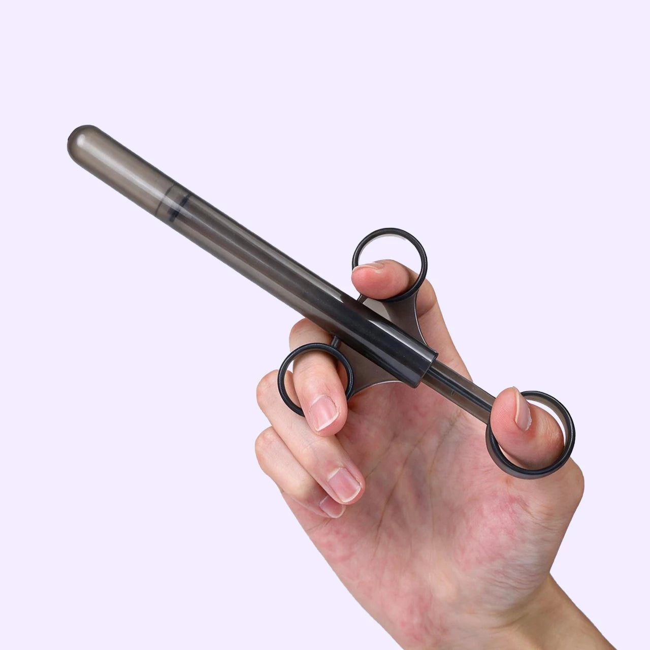 BEISAR Prelude silicone lubricant applicator shown in hand for size and design reference